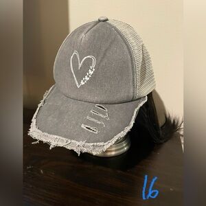 Unisex mesh trucker-style hat. Cute heart design. Distressed black. Adjustable.